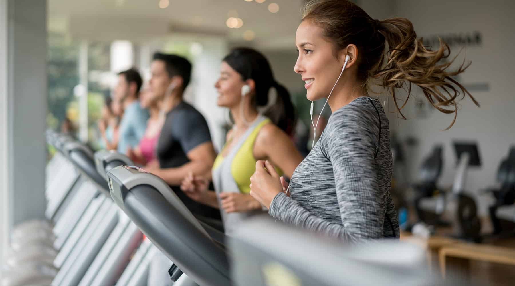 A group of residents working out in treadmill machines at a Concorde, California's apartment fitness center.