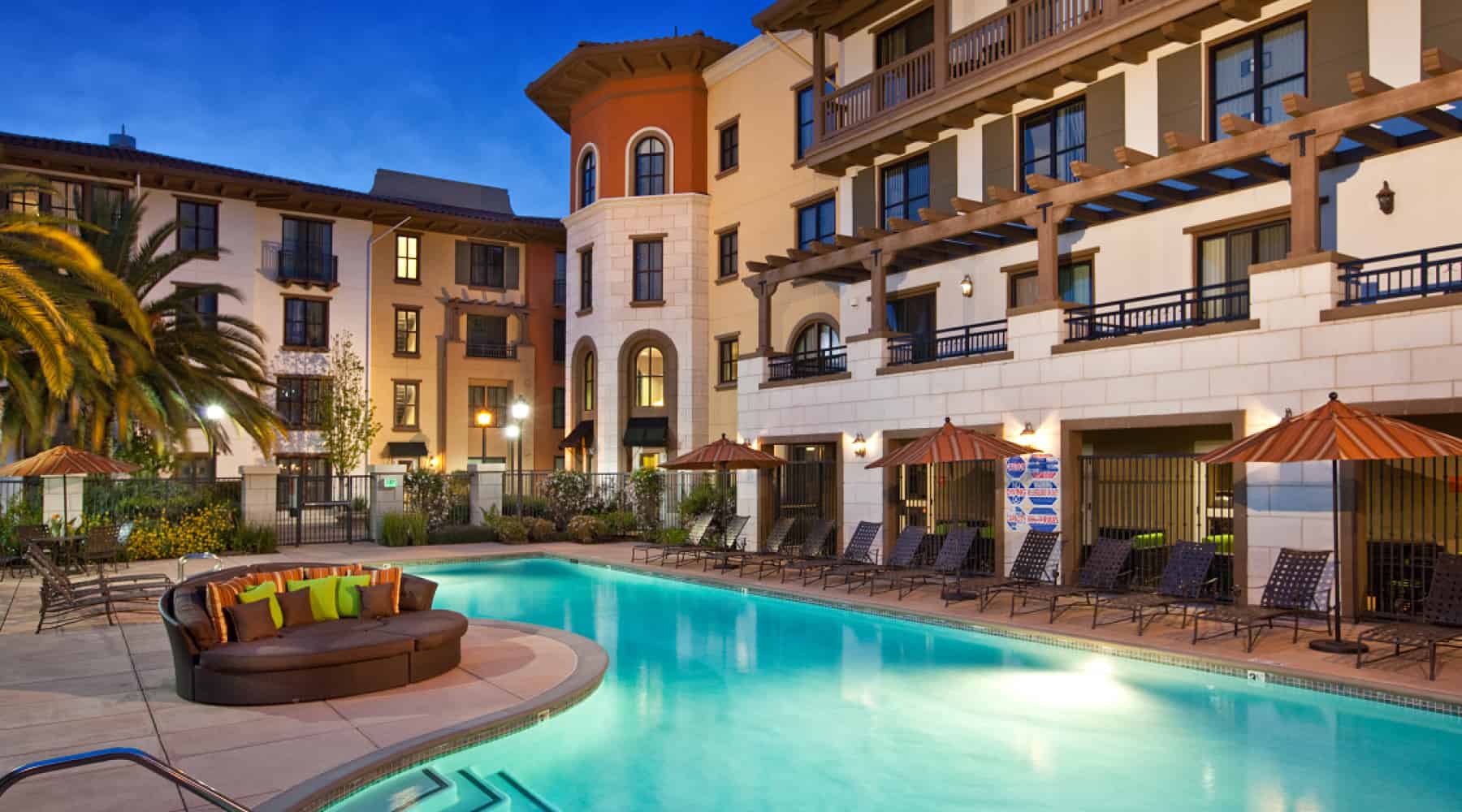 Outdoor swimming pool in a fenced area at Concorde, CA apartment community